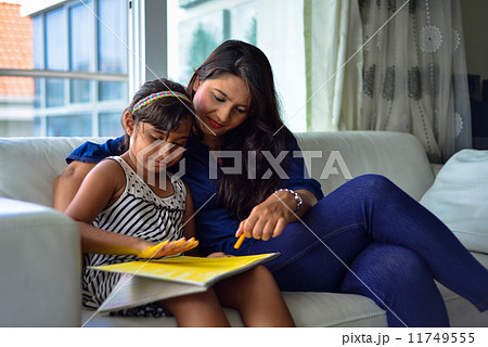 Asian Mother and daughter having quality family bonding time together Asian Mother and daughter having quality family bonding time together 11749555