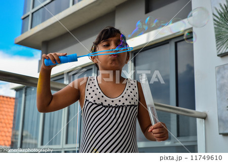 Asian girl enjoying her playing time 11749610