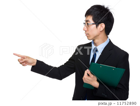 Businessman with clipboard with finger point aside Businessman with clipboard with finger point aside 11752890