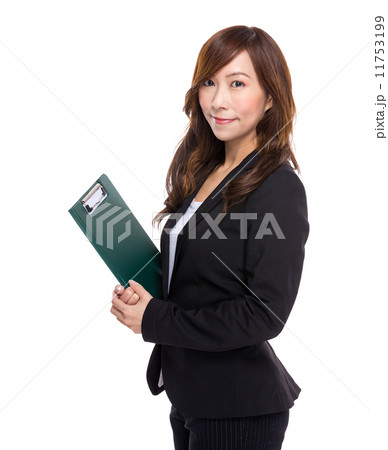 Businesswoman with file pad Businesswoman with file pad 11753199