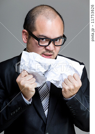 Angry business man tear paper off Angry business man tear paper off 11753626