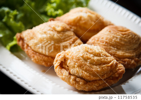 Samosas Pastry on a plate. 11758535