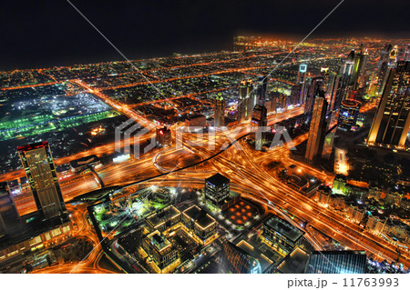 Dubai downtown night scene with city lights and roads in United Arab Emirates Dubai downtown night scene with city lights and roads in United Arab Emirates 11763993