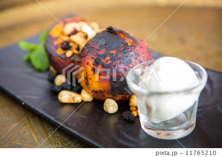 Grilled peaches with nuts and ice-cream Grilled peaches with nuts and ice-cream 11765210