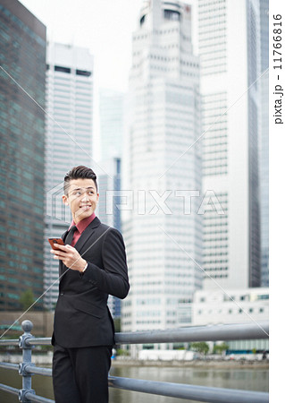 Businessman Texting in the City Businessman Texting in the City 11766816