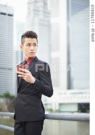 Businessman Texting in the City 11766819