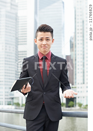 Businessman with Notebook in the City 11766829