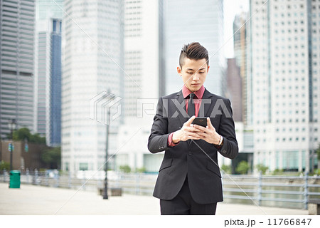 Businessman Texting in the City Businessman Texting in the City 11766847