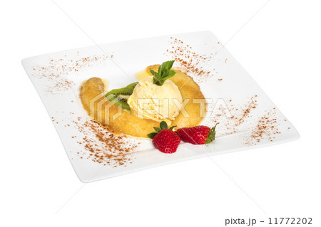 Dessert of banana, ice-cream, caramel, strawberry and mint 11772202