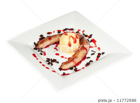 Bake banana with vanilla ice cream and caramel syrup; isolated o 11772686
