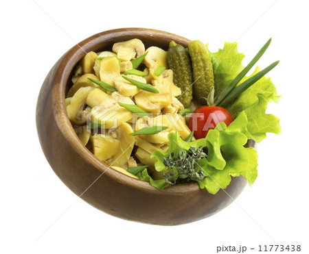 Marinated mushrooms in white saucer isolated on white 11773438