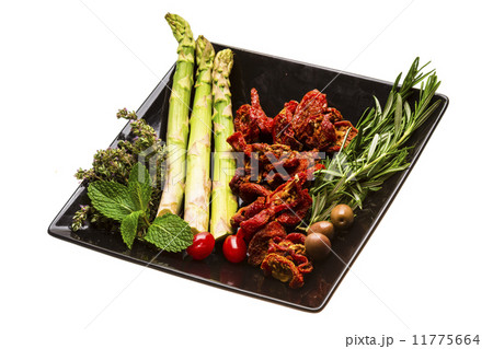 Dried tomato with asparagus and herbs 11775664