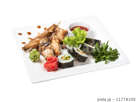 Buffalo chicken wings on plate with sushi Buffalo chicken wings on plate with sushi 11778100