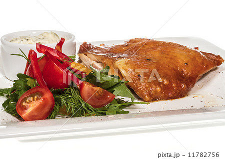 roasted chicken with vegetables on a white plate 11782756