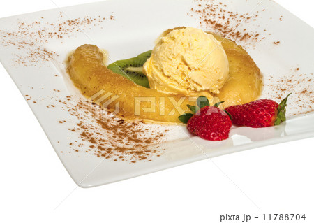 Dessert of banana, ice-cream, caramel, strawberry and mint Dessert of banana, ice-cream, caramel, strawberry and mint 11788704