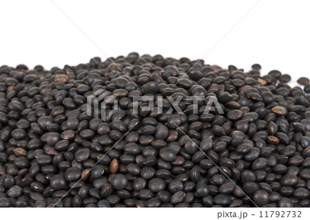 Heap of black lentil isolated on white Heap of black lentil isolated on white 11792732