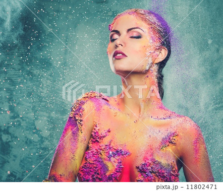 Beautiful young woman with conceptual colourful body art 11802471