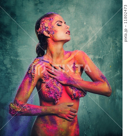 Beautiful young woman with conceptual colourful body art 11802473