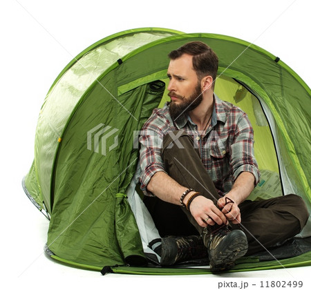 Handsome traveler in a tent 11802499