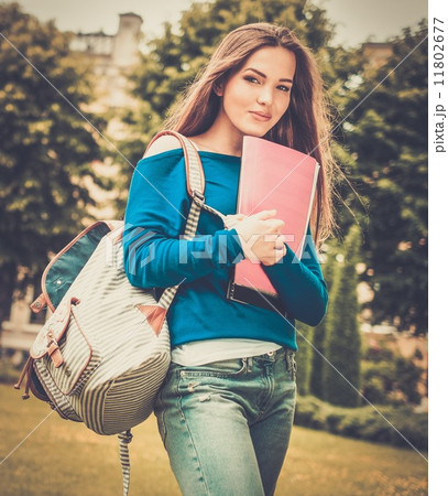 Beautiful young student girl in a city park on summer day 11802677