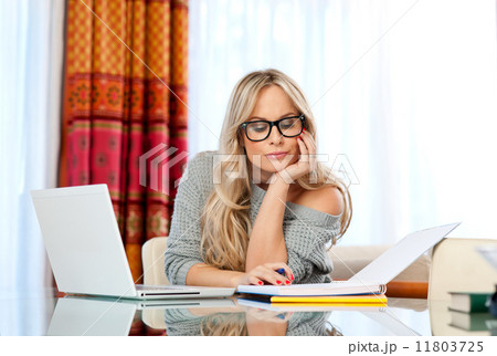 attractive woman writing on laptop 11803725