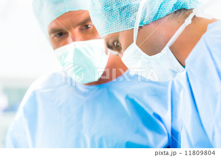 Surgeons or doctors in operating room of hospital Surgeons or doctors in operating room of hospital 11809804