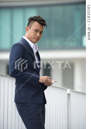 Stressful young Chinese businessman Stressful young Chinese businessman 11810161