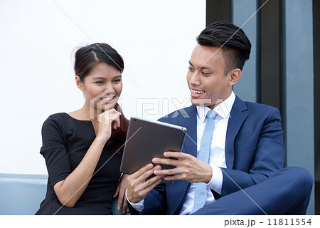 Young successful mixed race corporate executive informal meeting outdoor Young successful mixed race corporate executive informal meeting outdoor 11811554