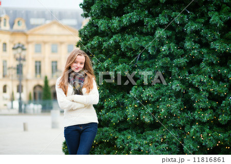 Girl on a Parisian street decorated for Christmas Girl on a Parisian street decorated for Christmas 11816861