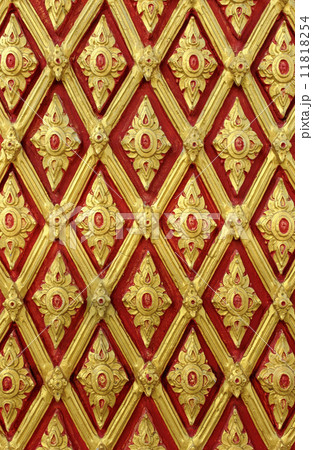 Traditional Thai style pattern decoration on the wall at Thai te 11818254