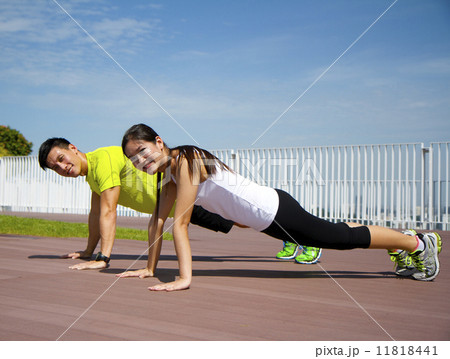 Young Asian Adults doing push ups 11818441