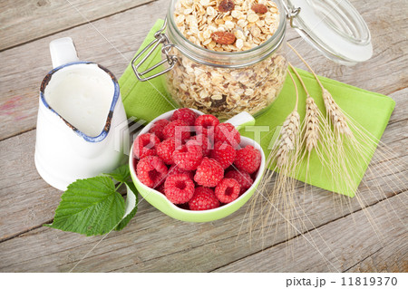 Healty breakfast with muesli, berries and milk Healty breakfast with muesli, berries and milk 11819370