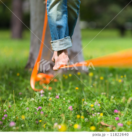 Slack line in the city park. 11822640