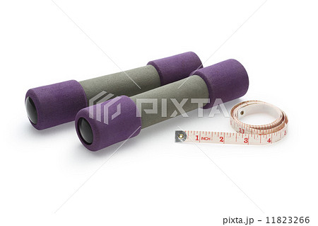 Two dumbbell and measure tape isolated on white background Two dumbbell and measure tape isolated on white background 11823266