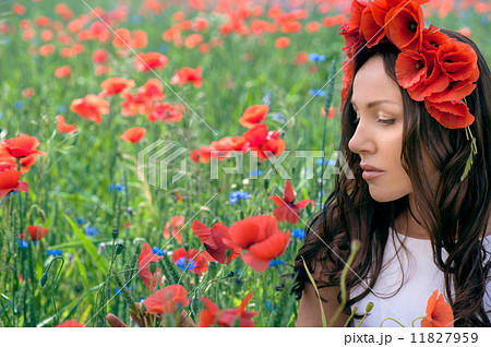Beautiful young brunette girl wearing white summer dress and flo 11827959