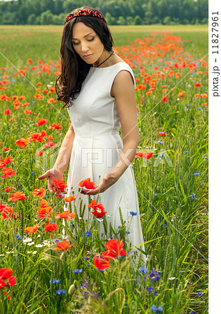 Beautiful young brunette girl wearing white summer dress in popp Beautiful young brunette girl wearing white summer dress in popp 11827961
