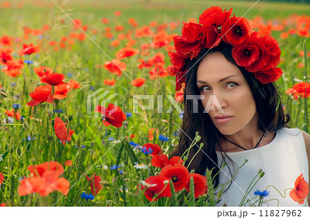 Beautiful young brunette girl wearing white summer dress and flo 11827962
