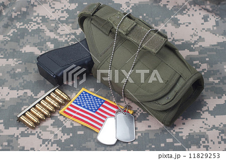 US ARMY concept with handgun on camouflage uniform US ARMY concept with handgun on camouflage uniform 11829253