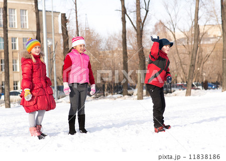 Children in Winter Park playing snowballs 11838186