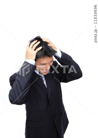 Young Business man thinking seriously Young Business man thinking seriously 11838696