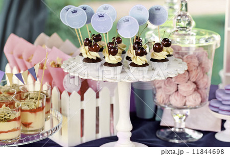Sweet holiday buffet with cupcakes and tiramisu glasses Sweet holiday buffet with cupcakes and tiramisu glasses 11844698