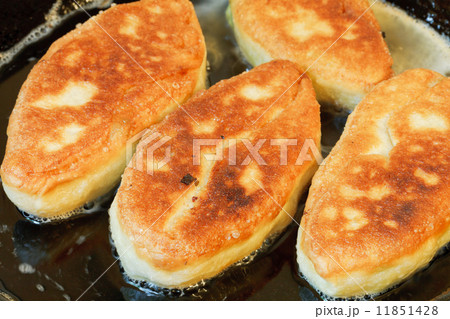 few patties in frying pan close up few patties in frying pan close up 11851428