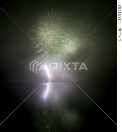 Colorful fireworks on black sky background with water reflection 11851502