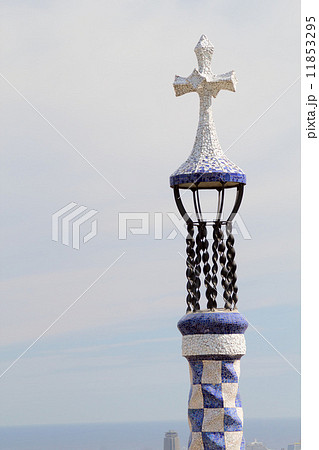 Park Guell's entrance pavilion mosaic steeple. Barcelona, Spain. 11853295