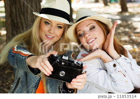 Two teenagers girl taking selfe with camera Two teenagers girl taking selfe with camera 11853514