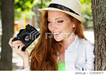 Nice girl photographer at work 11856977