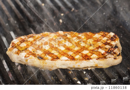 cooking steak grilled salmon in the kitchen at the restaurant cooking steak grilled salmon in the kitchen at the restaurant 11860138