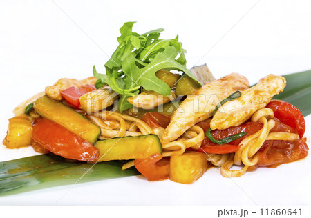 spaghetti with chicken and vegetables on a white background in the restaurant 11860641