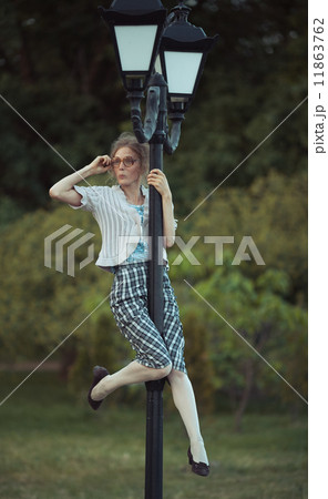 Funny girl with glasses and a vintage dress 11863762