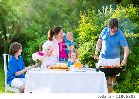 Big family grilling meat for lunch 11866883